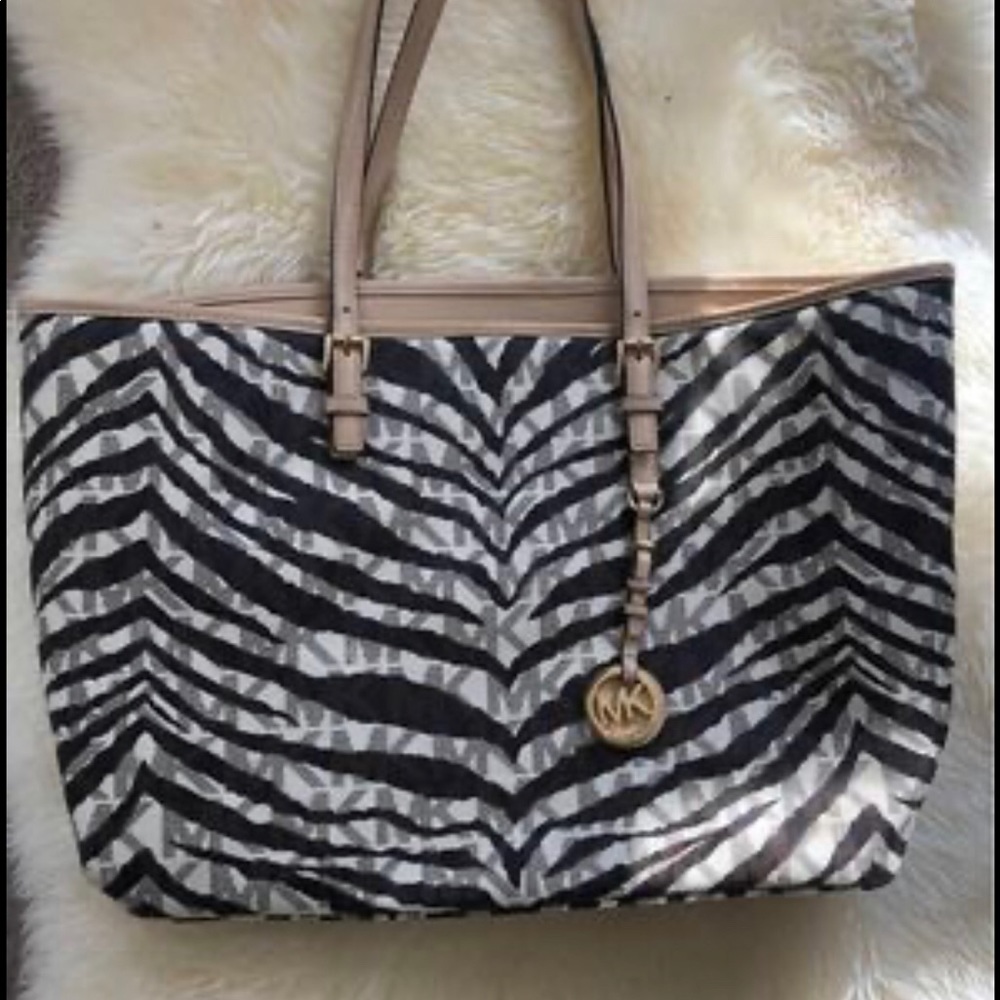 Michael Kors Zebra Canvas tote w padded laptop zipper pouch in the middle.